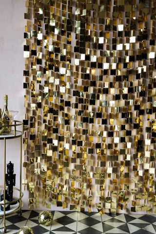 Lifestyle image of the Gold Sequin Hanging Christmas Backdrop