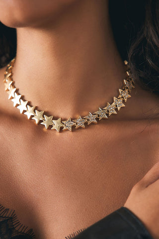 Lifestyle image of the Gold Star Hoop Necklace