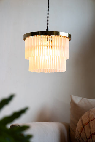 Image of the Gold Tiered Glass Easyfit Ceiling Light Shade hanging above a pale armchair