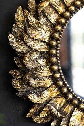 Close-up image of the Golden Feather Round Wall Mirror