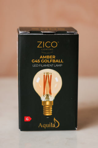 Image of Golf Ball E14 4W Amber LED Light Bulb in a box. 