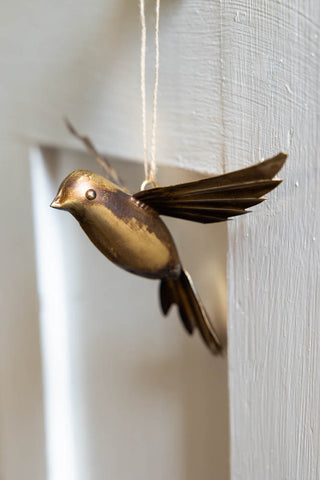 Lifestyle image of the Antique Gold Bird Hanging Ornament