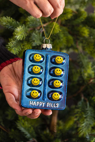 Lifestyle image of the Happy Pill Glass Christmas Tree Decoration