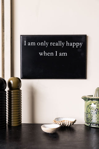 Chalkboard with 'i am only really happy when'