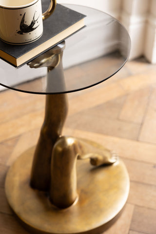 A birds eye view shot of the Gold Kicking Legs Side Table with Glass Top.