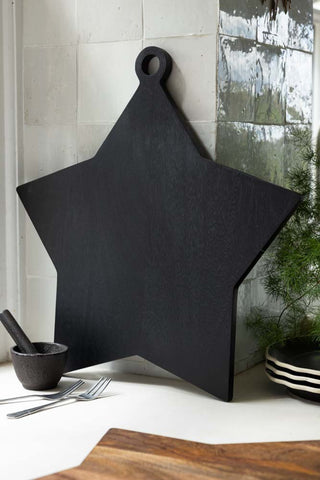 Lifestyle image of the Large Black Star Serving Board