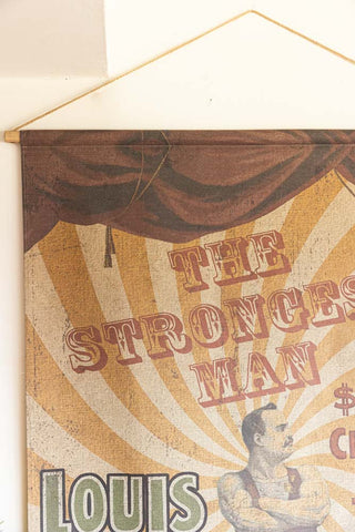 Close-up of the top corner of the Large Vintage-Style World's Strongest Man Wall Art.