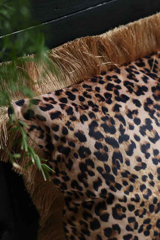 Close-up image of the Leopard Love Velvet Fringe Feather Filled Cushion