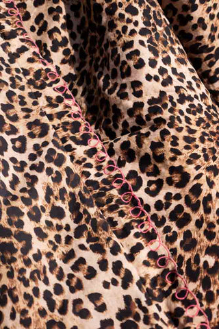 Close-up of the Leopard Print Scalloped Edge Quilt.