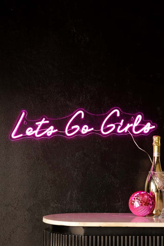 Lifestyle image of the Let's Go Girls Neon Wall Light