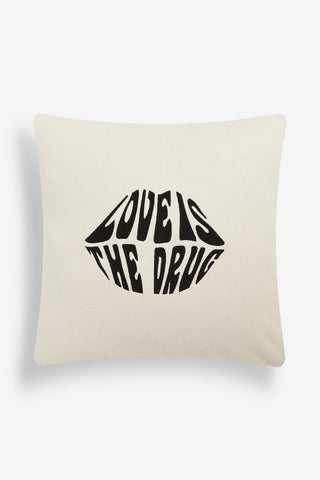 Image of the Love Is The Drug Knitted Lips Cushion on a white background