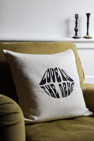 Image of the Love Is The Drug Knitted Lips Cushion
