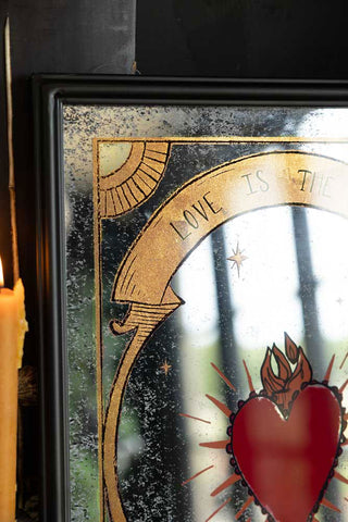 The beautiful love is the drug decorative mirror with a gold banner reading 'love is the drug'