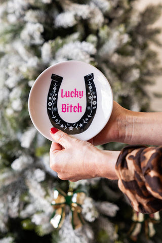 Lifestyle image of the Lucky Bitch Decorative Wall Plate