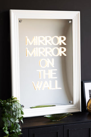 The Mirror, Mirror...Framed Neon Wall Light and mirrored wall art with a white frame styled on a sideboard.