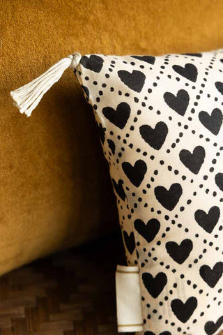 Image of the tassel on the Mini Monochrome Heart Cotton Cushion
