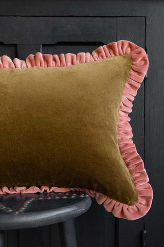Image of the Moss Green Velvet Cushion With Pink Ruffle