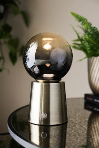 Lifestyle image of the Ombre Orb Rechargable USB Table Light
