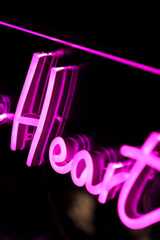 Close-up image of the One Love One Heart Neon Wall Light