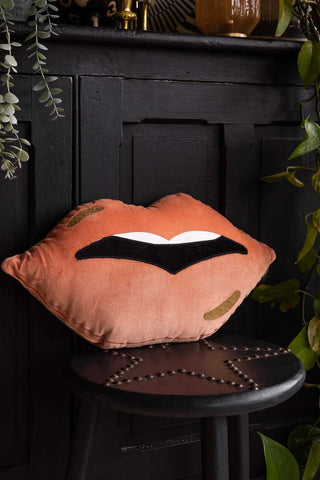 Lifestyle image of the Pink Lips Cushion