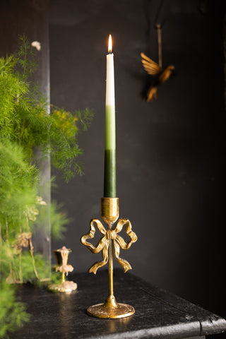 Lifestyle image of the Pretty Gold Metal Bow Candle Holder