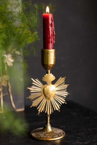Lifestyle image of the Pretty Gold Milagro Heart Candle Holder