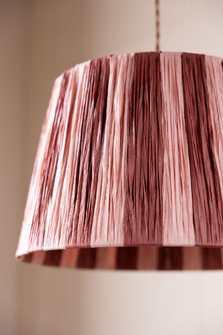 close up of the Raffia Pink & Red Stripe Lampshade hanging from the ceiling