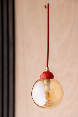 Lifestyle image of the Red Glass Dome Metal Ceiling Light