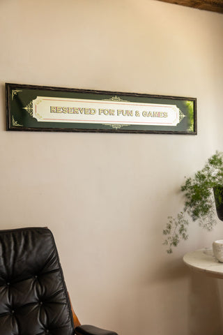Lifestyle image of the Reserved For Fun & Games Vintage-Style Mirror