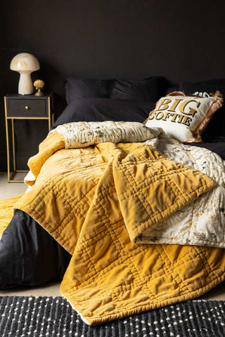 A beautiful styled image of the Reversible Gold Rock & Rose Blanket.