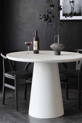 Lifestyle image of the Round Indoor/Outdoor Dining Table In Off-White