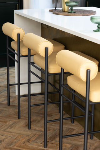 three Sand Faux Leather Roll Back Bar Stools at kitchen island