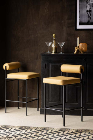 Lifestyle image of the Sand Faux Leather Roll Back Bar Stool
