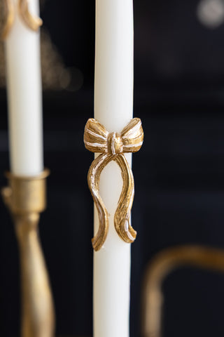 Close-up image of the Set of 2 Gold Bow Table Candles