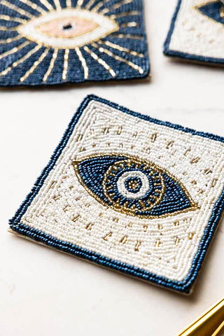 Close-up of one of the Set of 4 Mystic Eye Coasters on a white surface.