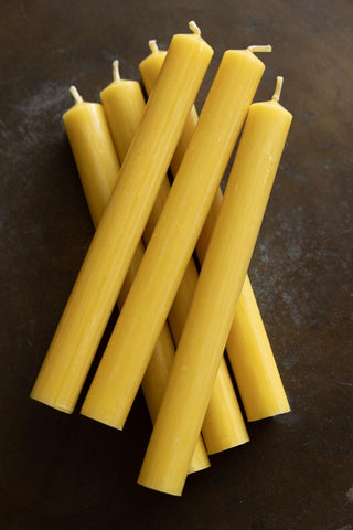 Close-up image of the Set of 6 Dinner Candles In Ochre