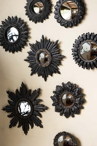 The Set of 9 Ornate Antique Black Framed convex mirror set displayed on a neutral wall.