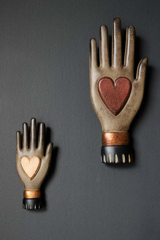 Image of the Small Off-White Heart On Hand Wall Ornament on the wall