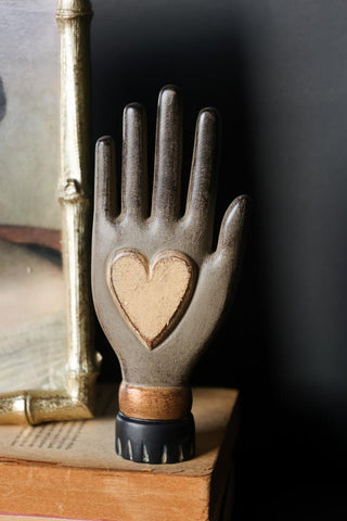 Lifestyle image of the Small Off-White Heart On Hand Wall Ornament