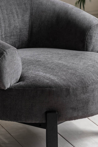 A close up of the Beautiful Curved Grey Accent Armchair.