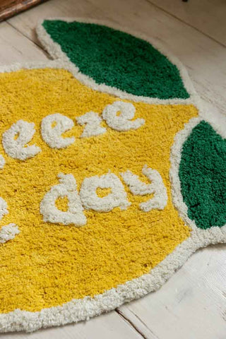 Close-up image of the Squeeze The Day Lemon Bath Mat