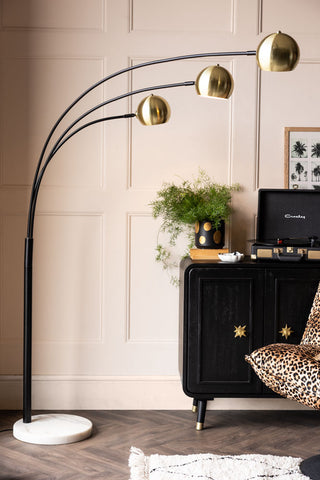 Image of the Statement Black & Gold Retro Arch Floor Lamp in a living room setting