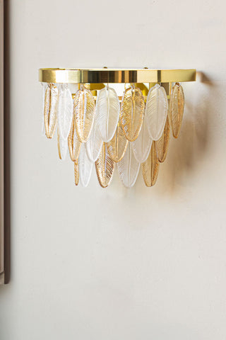The Stunning Art Deco Glass Feather Wall Light displayed on a neutral wall.