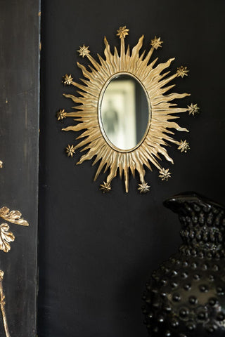 Image of the Antique Silver Sunburst & Stars Mirror on a wall