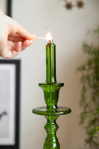 Close-up image of the Tall Green Glass Refillable Candle Holder