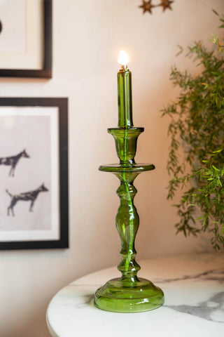 Lifestyle image of the Tall Green Glass Refillable Candle Holder