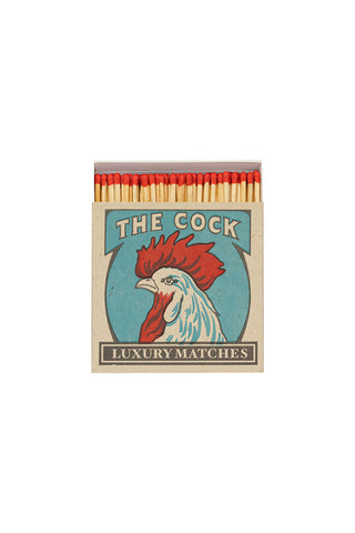 Cutout image of The Cock Luxury Matches on a white background. 
