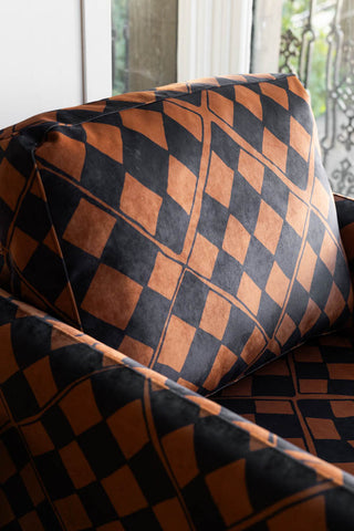 Close-up image of the The Edie Caramel Checkerboard Velvet Armchair