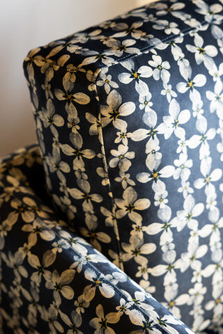 Close-up of The Edie Daisy Print Velvet Armchair.