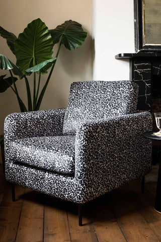 Lifestyle image of the The Edie Monochrome Leopard Velvet Armchair